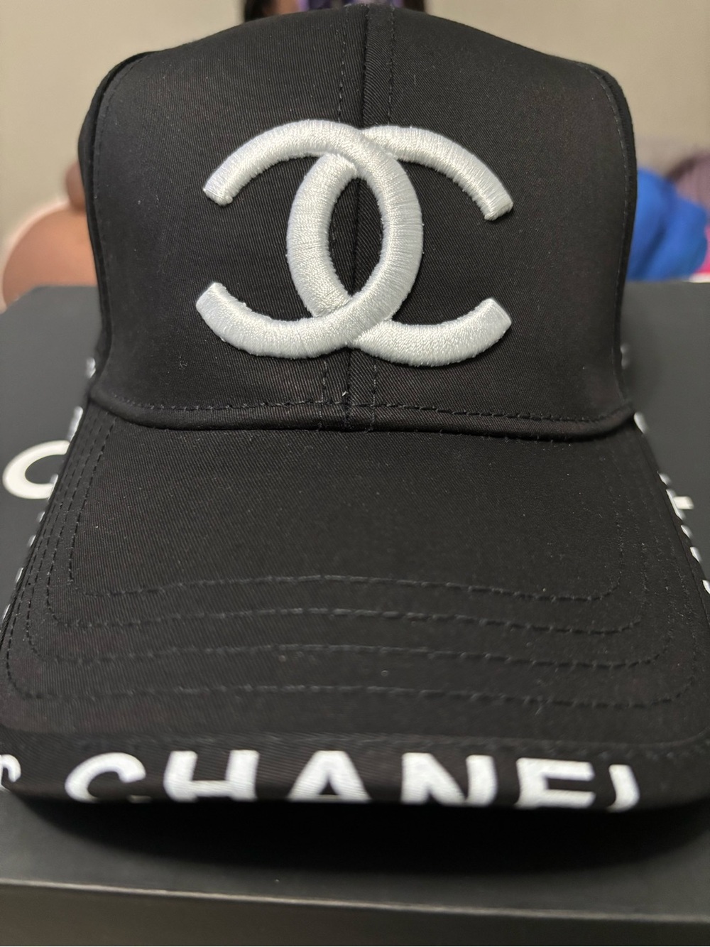 CHANEL Black Cap with White CC Emblem